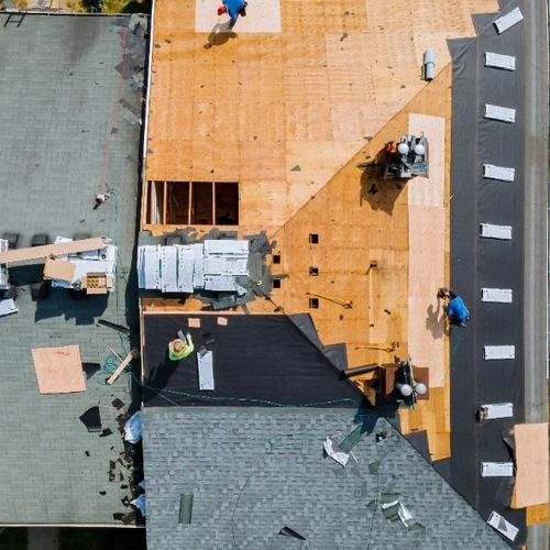 view from above of workers providing roof replacement services