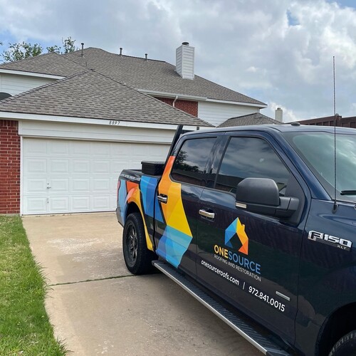 company truck in front of a home with a shingle roofing system